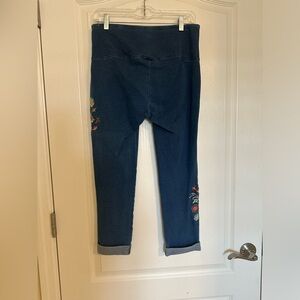 jeans with flower pattern on sides, folded end.
